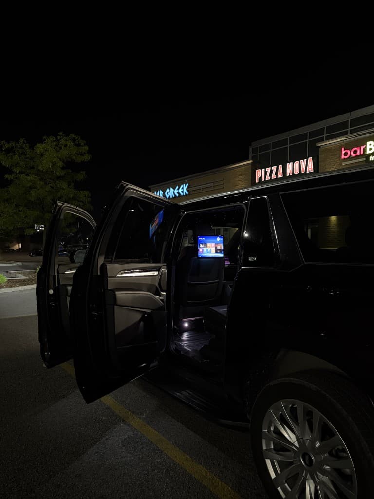 Pearson Limo Escalade with cabin open showing entertainment screen